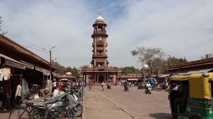 Jodhpur, Rajasthan, India 2nd March 2023: Popular landmark Ghanta Ghar also known as Clock tower of Jodhpur and Sardar Market, Jodhpur. People walking and shopping around market. City View of Jodhpur - obrazy, fototapety, plakaty