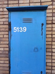 blue mailbox on a wall