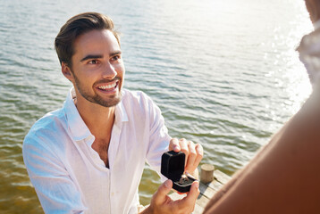 Engagement, proposal and man by lake with ring for romantic holiday, vacation and honeymoon in...