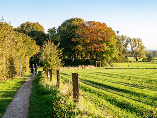 Walkers on footpath through nature near town of Ootmarsum, Overijssel, Netherlands