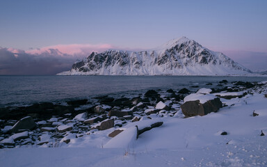 Fantastic colorful sunset on Skagsanden beach. Amazing Norway natural seascape. popular touristic attraction. Lofoten islands is a Best famouse travel locations. Scenic Image of nature landscape.