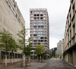 Fototapeta premium Urban landscape in Zurich with modern wooden roof and skyscrapers in the distance