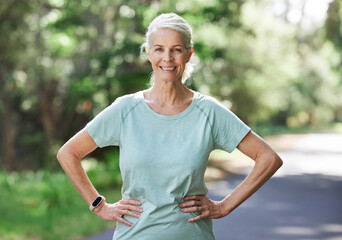 Senior woman, exercise and outdoor for a run, workout and training on road with trees for fitness....
