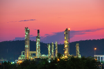 Obraz na płótnie Canvas Twilight sun orange scene of oil refinery plant and tower column oil of Petrochemistry industry
