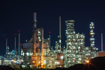 Fototapeta na wymiar Night scene of oil refinery plant and tower column of Petrochemistry industry site construction