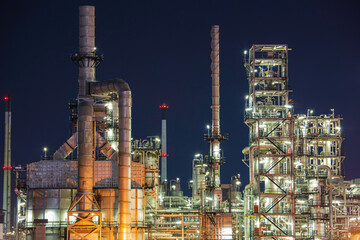 Night scene of oil refinery plant and tower column of Petrochemistry industry site construction