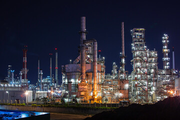 Night scene of oil refinery plant and tower column of Petrochemistry industry site construction