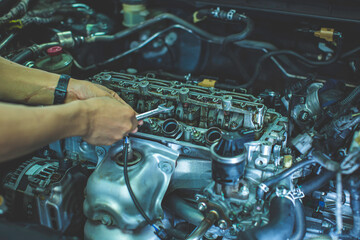 Engineer and Car Repair concepts car engine dirty hands holding tools using