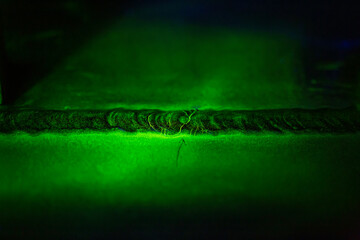 Crack steel butt weld carbon background green contrast magnetic filed
