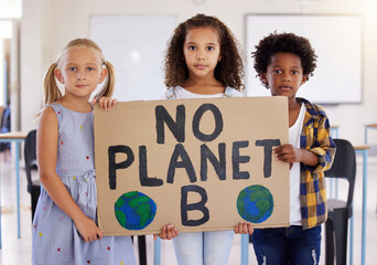 Kids, portrait and poster with friends in protest in a classroom holding a sign for eco friendly activism. Children, green and a kindergarten group standing together for community or ecology