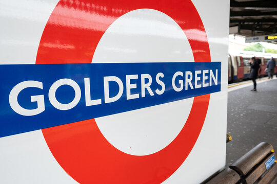 London- Golders Green Underground logo on platform, Northern Line tube station