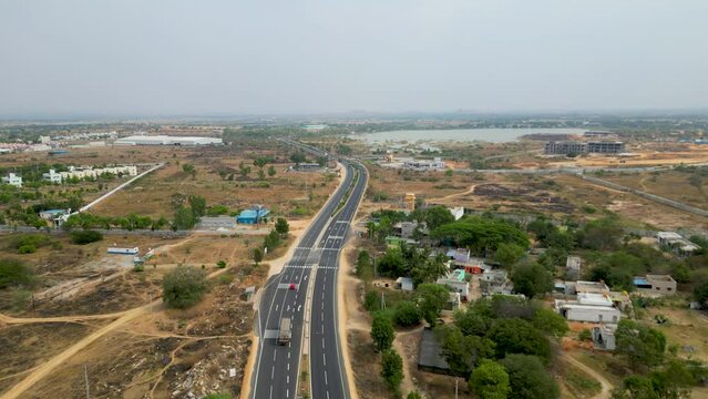 DRONE | 4k | 60 FPS 

Aerial view of a 4-lane highway in India.  
Shot from a drone, this is a 4-lane highway connecting the cities of Hyderabad and Bangalore. 