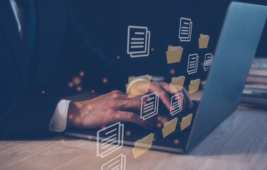 Document Management System (DMS), businessman working on computer laptop folder document icon, knowledge and documentation in enterprise with ERP. Corporate business technology.