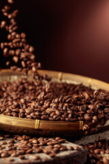 Medium-roasted coffee beans are poured into a basket.