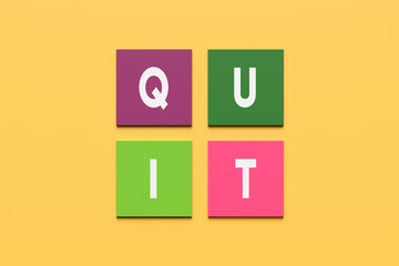 The word quit on colorful square blocks on yellow background. To quit smoking, quitting a job resignation or quitting something concept.