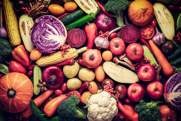 background of a mix of assorted vegetables and fruits of fresh harvest