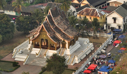 Aerial view of the Haw Pha Bang Temple or Royal Palace in Luang Prabang and night market, Laos