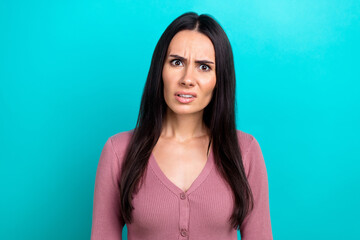 Fototapeta premium Portrait of unsatisfied confused person look questioned isolated on emerald color background