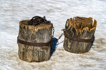 shackles on wooden stumps