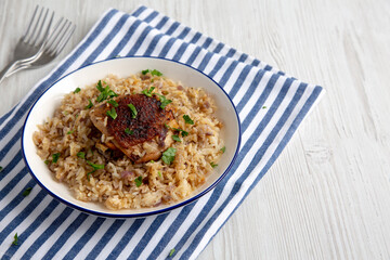 Homemade Paprika Chicken and Rice on a Plate, side view. Copy space.