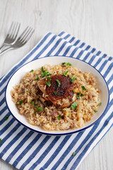 Homemade Paprika Chicken and Rice on a Plate, side view.