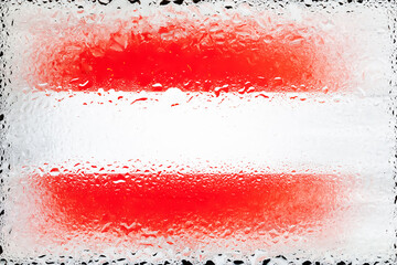 Austria flag. Flag of Austria on the background of water drops. Flag with raindrops. Splashes on glass
