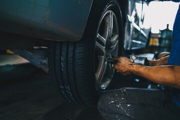 Mechanical man maintenance car brake and fix in tire shop