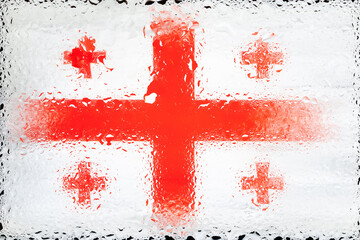 Georgia flag. Flag of Georgia on the background of water drops. Flag with raindrops. Splashes on glass