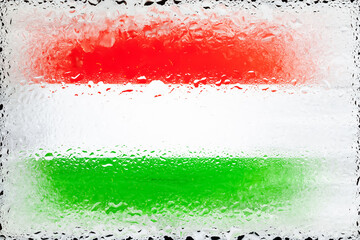 Hungary flag. Flag of Hungary on the background of water drops. Flag with raindrops. Splashes on glass