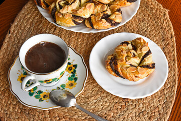 Black coffee with a sweet bun