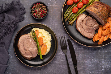 Food photography of roasted lamb, carrot, asparagus, tomato, seasoning, pepper