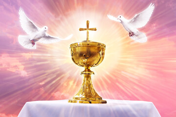 Chalice with crucifix in an altar with flying doves. Holy eucharist theme concept.