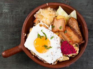 Breakfast dish - scrambled eggs with fried bacon