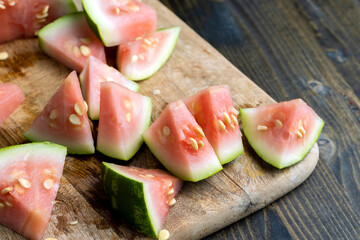 Unripe watermelon of small size with large white seeds