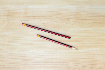 Obraz premium A photo of pencils isolated on wooden background, after some edits.