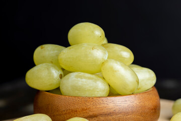 Harvested green grapes on the table