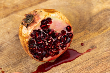 Half-cut ripe red pomegranate with mold