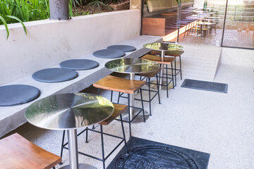 Circular metal table and chair at restaurant.