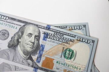  A close-up of a hundred dollar bill featuring Benjamin Franklin, the iconic symbol of American finance and success. The perfect representation of wealth, prosperity and credit exchange.