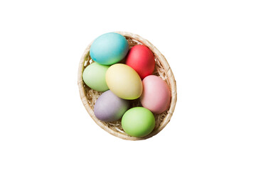 Basket of colorful Easter eggs isolated on white background. Easter basket filled with colored eggs top view holiday concept