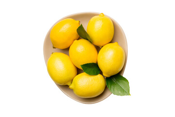 Fresh cutted lemon and whole lemons over round plate isolated on white background. Food and drink ingredients preparing. healthy eating theme top view with copy space