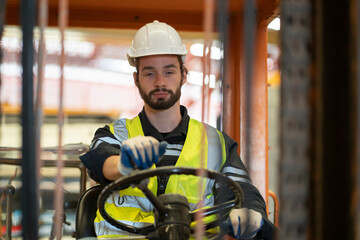 Male worker driving a forklift while falling asleep. dangerous while working © Duangporn