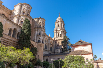 Fototapeta na wymiar Malaga Spain downtown historic are with an old church and architecture