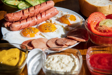Breakfast with fried egg, hot dog and ham...