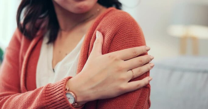 Feeling, injury and hand of a woman with arm pain from an accident, muscle strain or weakness. Touching, sensitive and person with a hurt, swollen and painful shoulder with an inflammation problem