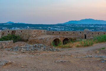 Sunset view of Venetian Fortezza Castle in Greek town Rethimno, Crete