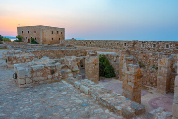 Sunset view of buildings at Venetian Fortezza Castle in Greek town Rethimno, Crete