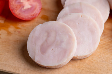 Sliced round-shaped ham from chicken meat