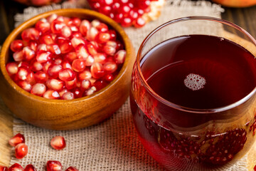Sweet and sour pomegranate juice in a transparent glass