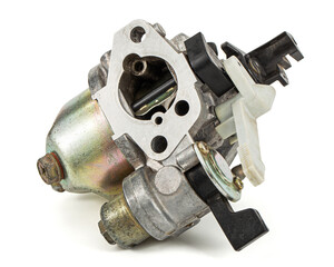 Carburetor, part of a gasoline internal combustion engine, spare part, isolated on a white...